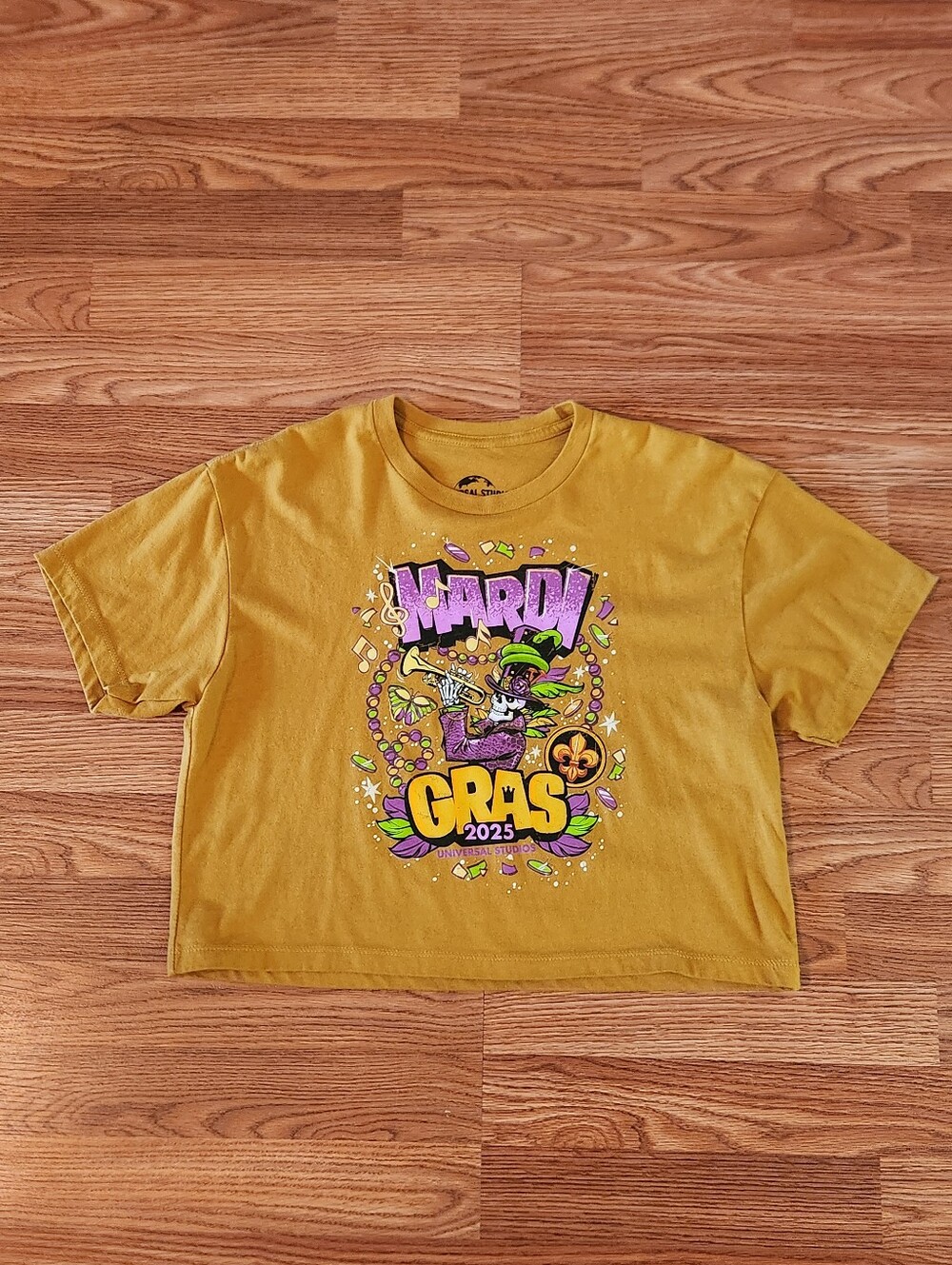 Universal Mustard Yellow Mardi Gras Graphic Cropped Tee Women's